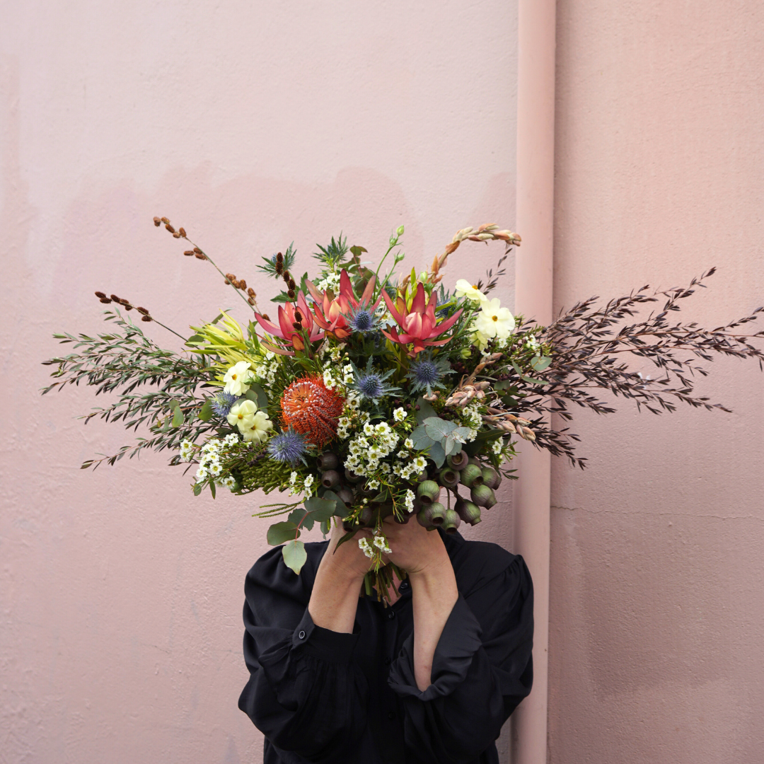 Bushland Birthday Wishes native flower arrangement featuring proteas, banksias, and wax flowers designed by FLORAqueen Fitzroy North